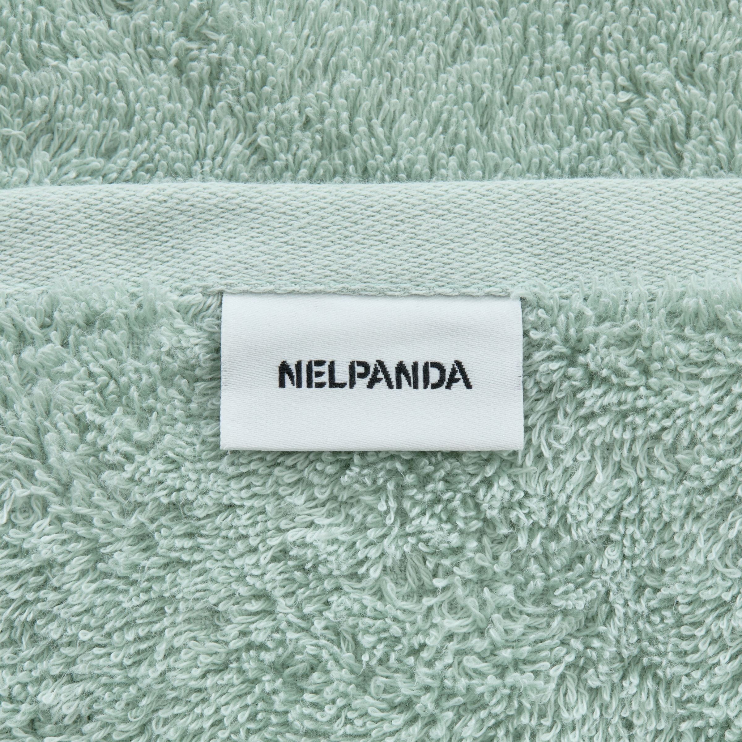 Green Egyptian cotton towel with a label displaying 'NIELPANDA' 