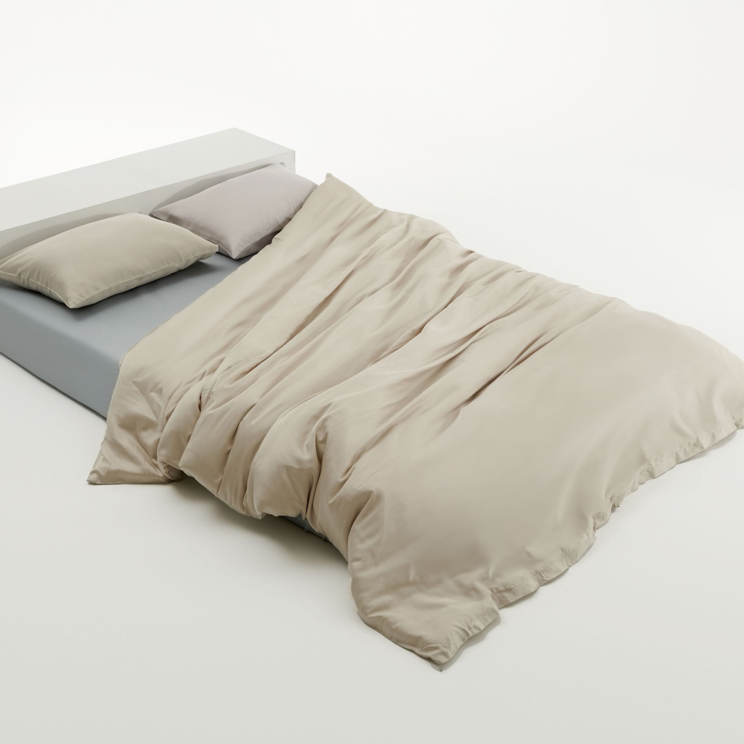 beige duvet cover and blue fitted sheet