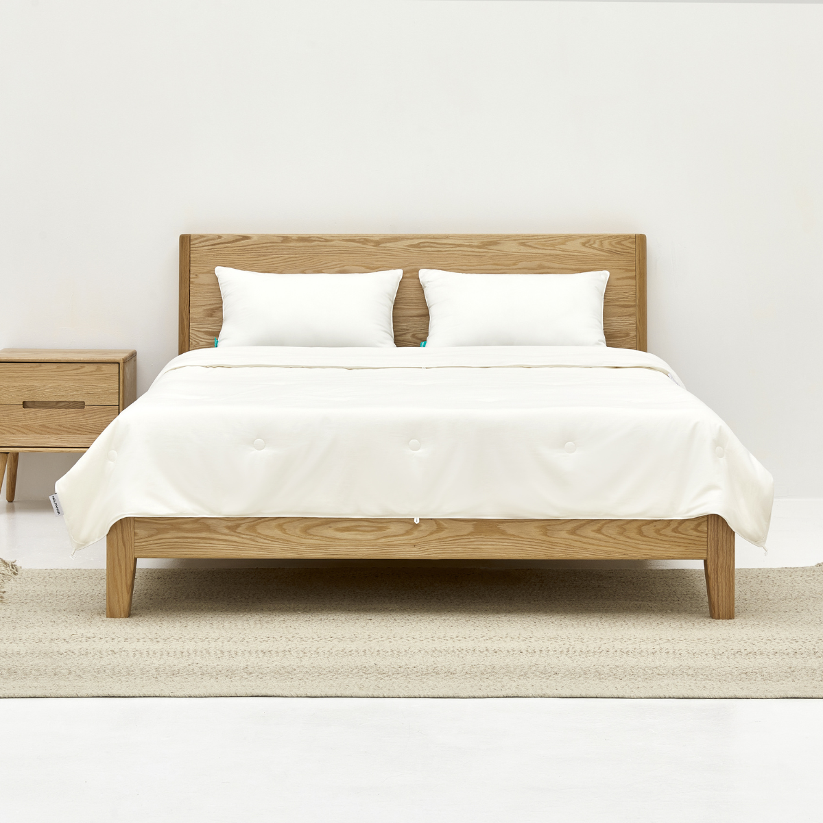 bedding with silk-filled duvet and white pillows