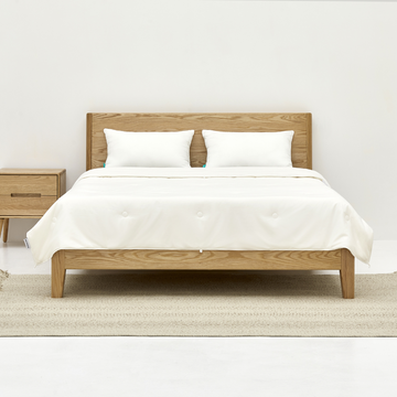bedding with silk-filled duvet and white pillows